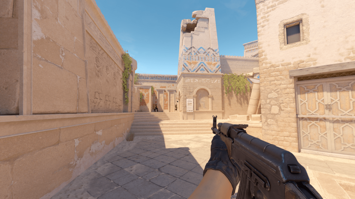 Player with an AK-47 in CS2's Anubis map.