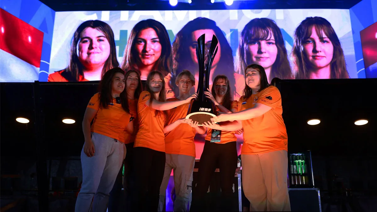 The Netherlands female CS:GO team holds a trophy celebrating their IESF Women's World Championship win in Riyadh, Saudi Arabia.
