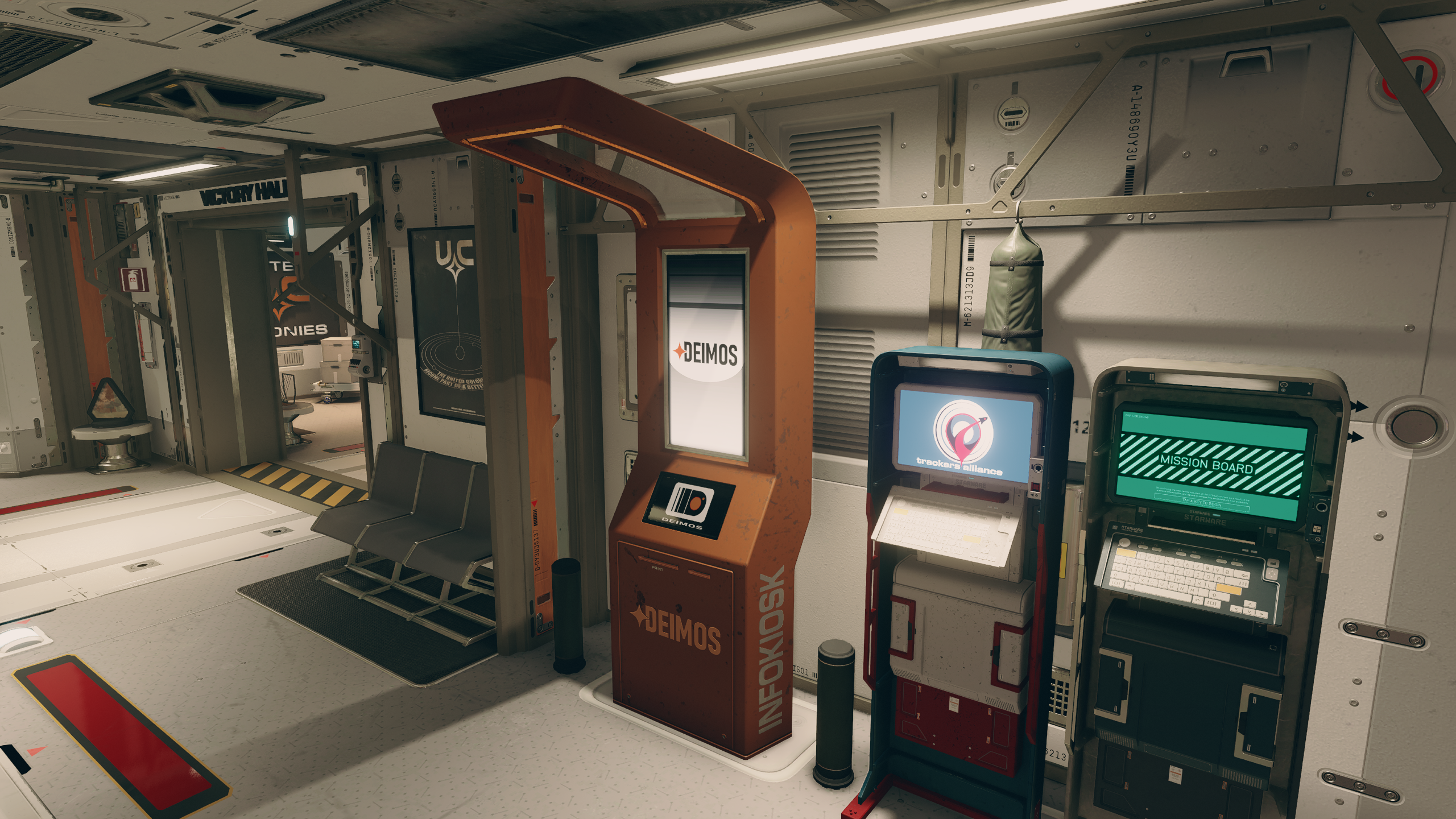 The Deimos Staryard Mission Board and Bounty Clearance Kiosk next to each other in Starfield.