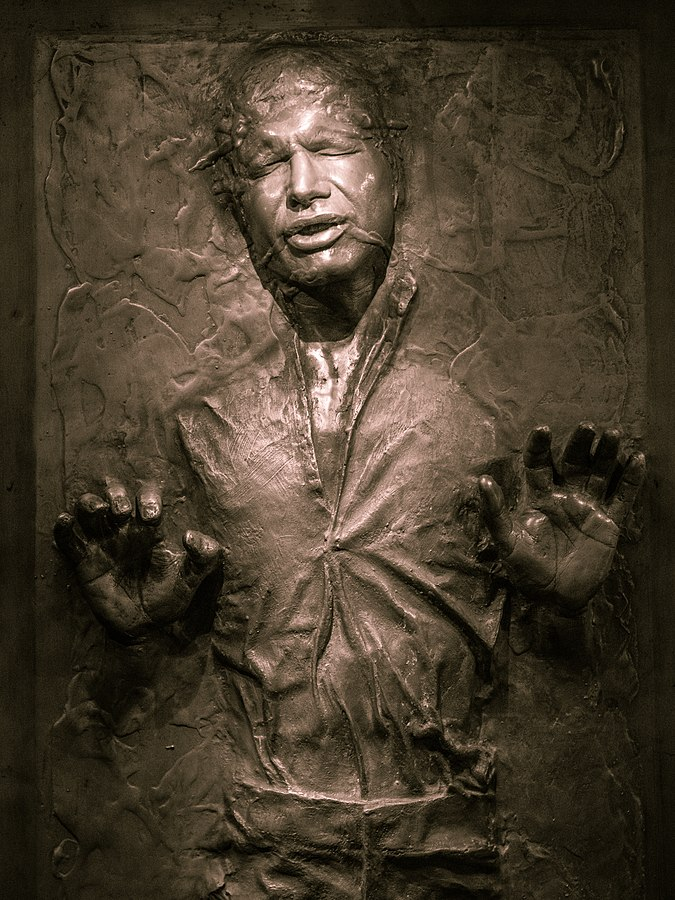 An image of Han Solo frozen in carbonite. 