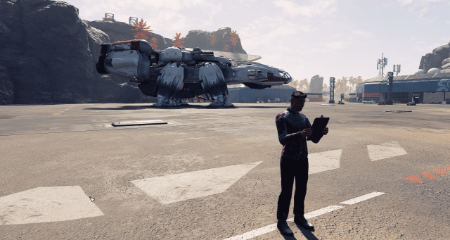 A ship technician stands checking a clipboard outside a landing zone with a ship near a cliff on Paradiso in Starfield.