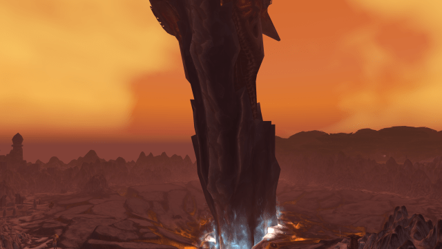 An in-game WoW screenshot of Sargeras' sword sticking out of the ground in Silithus. 
