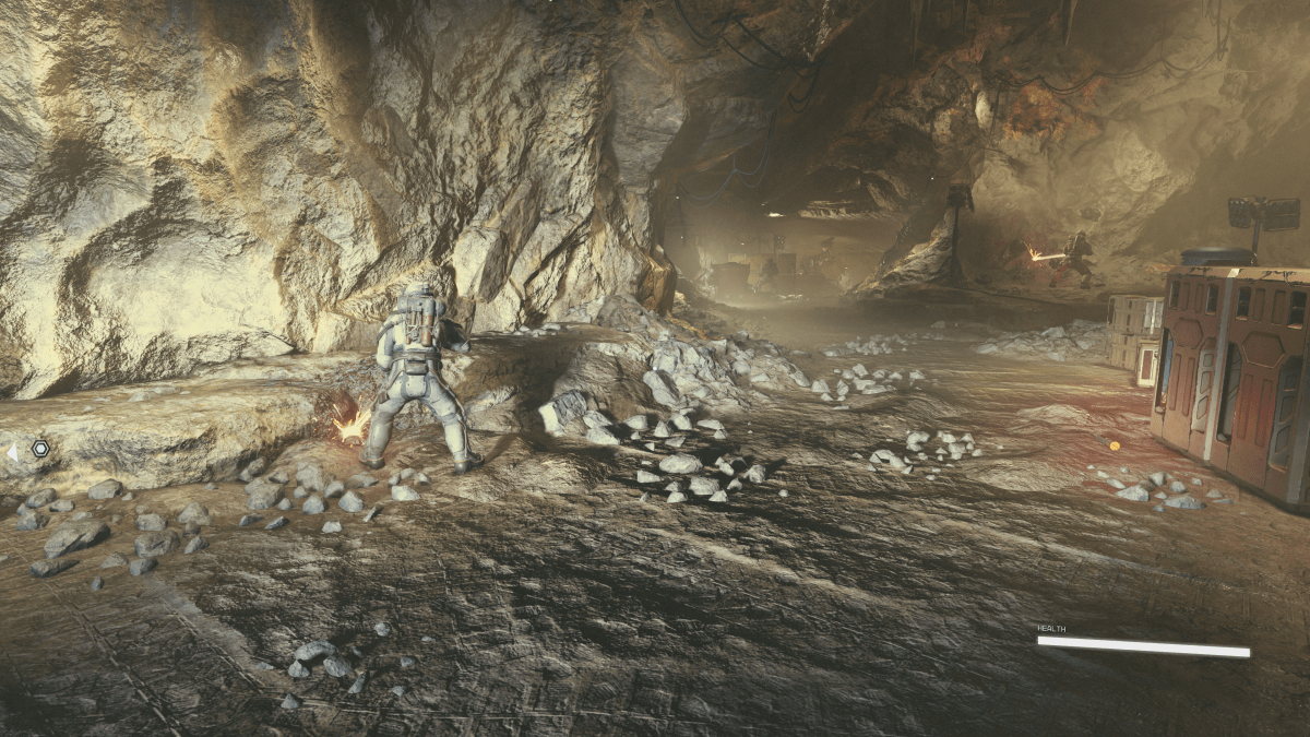 A mine with workers collecting ore in Starfield.