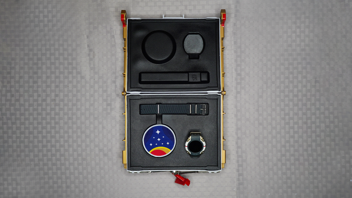 A photo of the inside of the Starfield watch case, with a strap and Starfield logo patch.