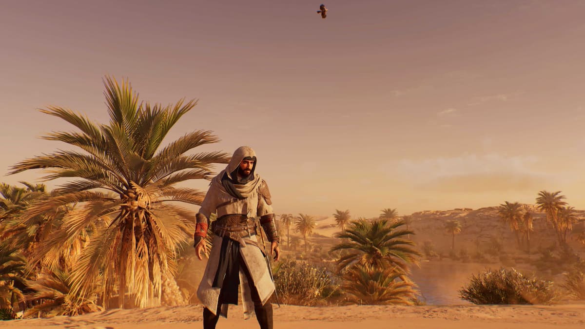 basim standing next to a palm tree