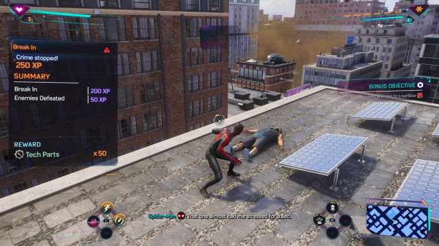 Spider-man acquiring tech parts after fighting some criminals on a rooftop