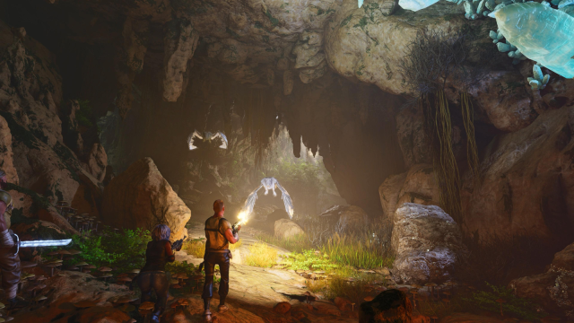 A group of players in a cave in Ark: Survival Ascended fighting off bats.