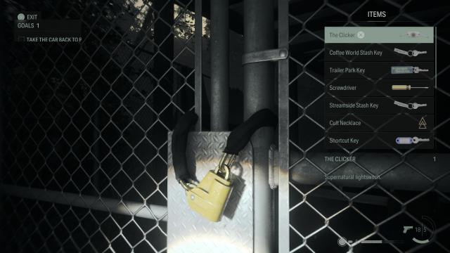 A chunky lock on a fence