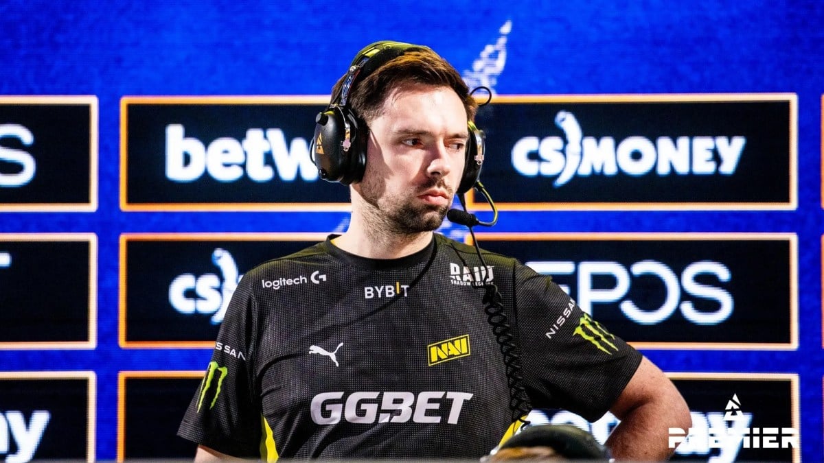 Coach B1ad3 standing behind his team, Natus Vincere, at one of the BLAST's tournaments.