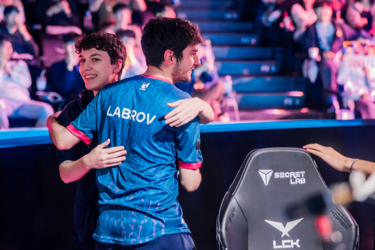 Adam and Labrov of Team BDS hug onstage between matches at the Worlds Qualifying Series at League of Legends World Championship 2023