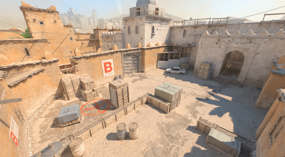 Screenshot taken of Dust 2's B Bombsite in Dust 2, featuring its famous car.