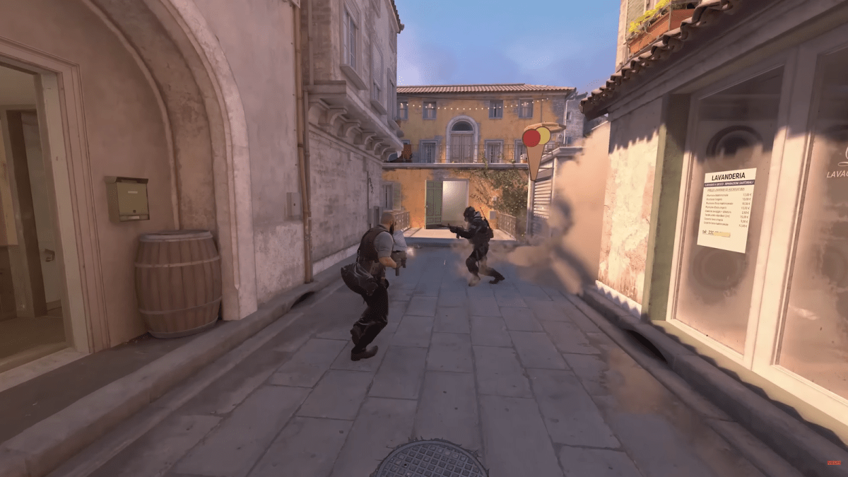 Italy in CS2 with a T and CT player fighting next to a smoke