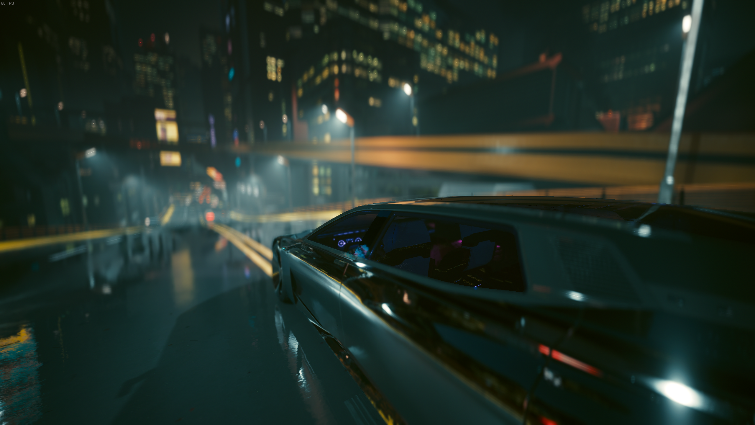Cyberpunk 2077 screenshot of a vehicle driving through the city