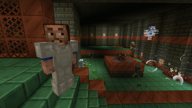A player standing in a Trial Chamber smiling at the camera as a Breeze flies in the background and their friend fights some mobs from a Trial Spawner.