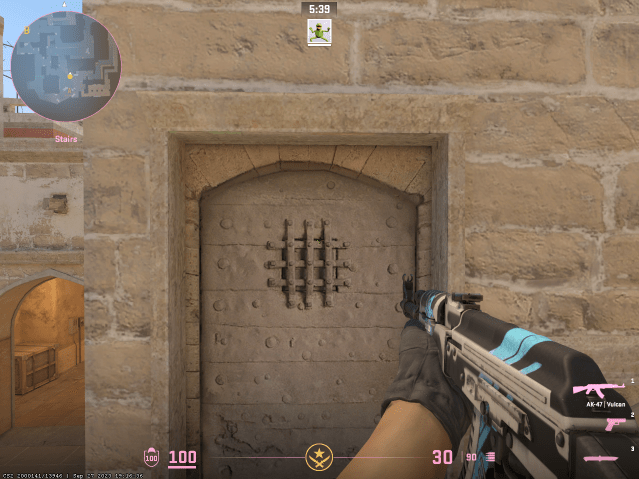 Desktop viewmodel position in cs2 on mirage a site staircase with an ak47 pointed at a door