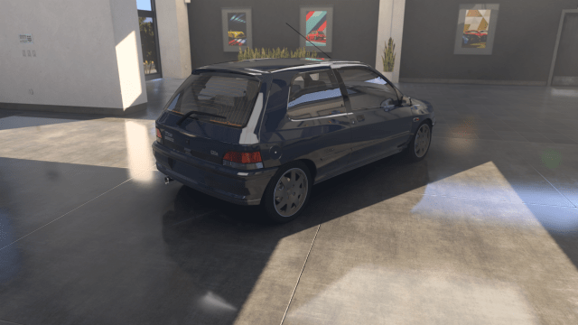 The 1993 Renault Clio Williams shown in a garage in Forza Motorsport.