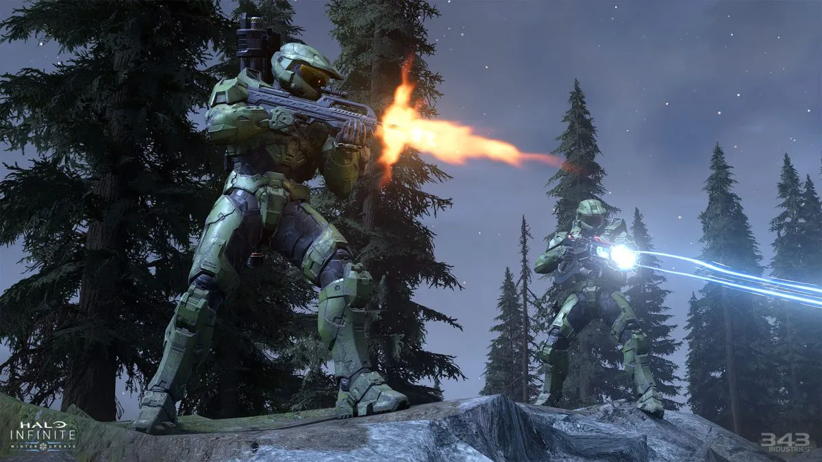 Two Spartans fire downwards with a Battle rifle and Shock Rifle.