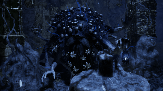 Molhu, a hairy dark blue creature covered in a blanket of flowers in Lords of the Fallen