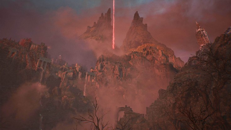Lords of the fallen rocky landscape with a red beam shooting out vertically in the distance