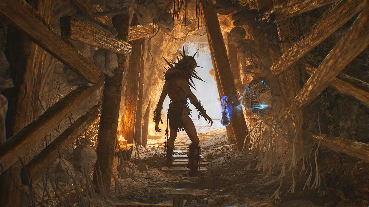 A spike-head monster in Lords of the Fallen standing in a cave entrance
