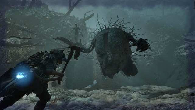 Lords of the Fallen character with an axe fighting a face monster in Umbral