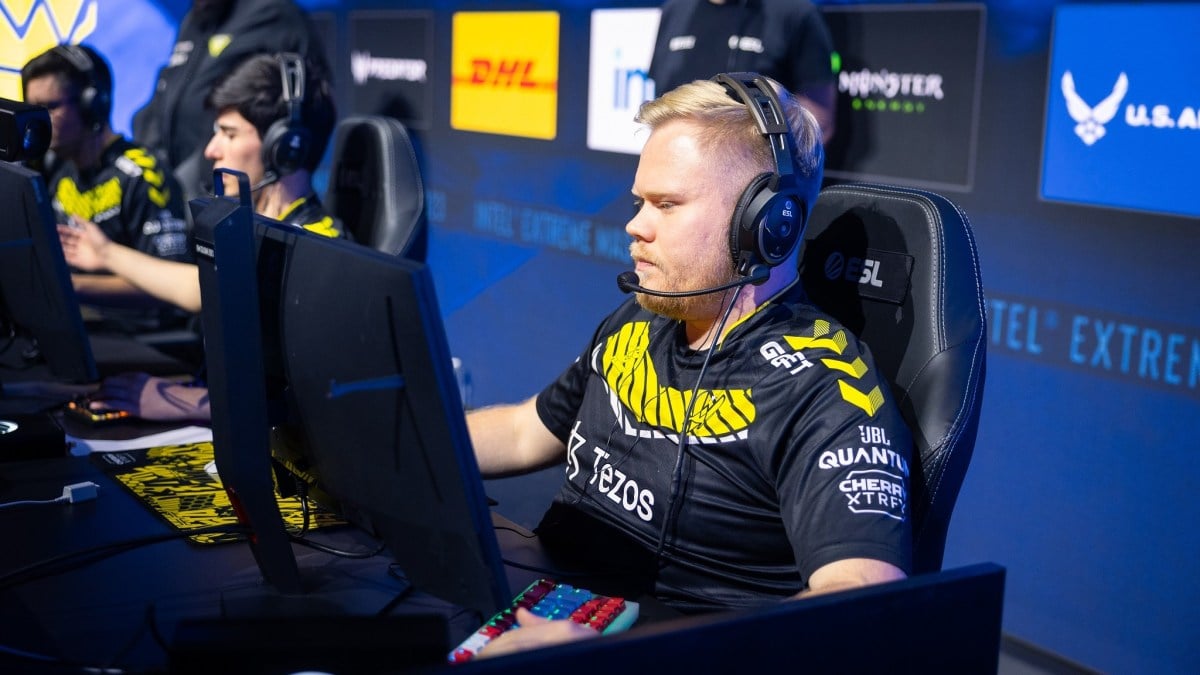 Danish Counter-Strike rifler Magisk playing for Vitality at IEM Cologne 2023. He's wearing Vitality's black and yellow jersey and has blonde hair.