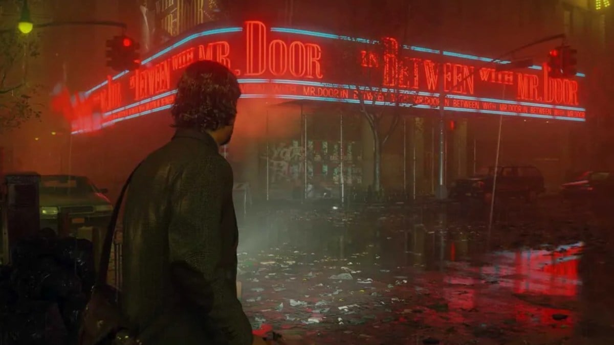 Alan Wake staring at some neon signs on a rainy night.