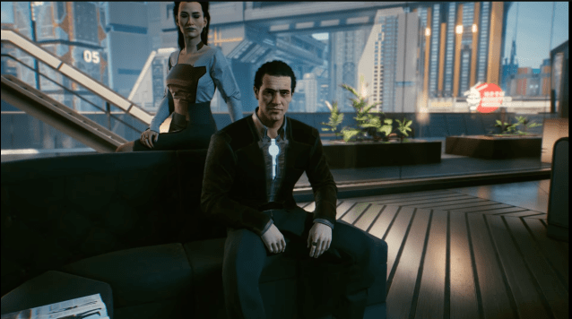 Screenshot of Juan and Elizabeth Peralez in their apartment in Cyberpunk 2077: Phantom Liberty