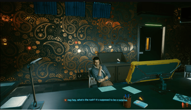 A concierge sits at a desk in Cyberpunk 2077.