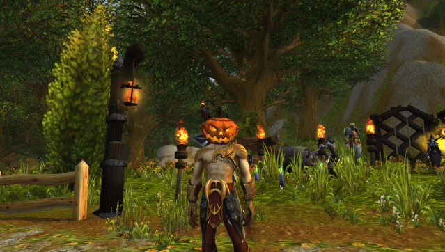 An Evoker in their visaged form wears a Hallowed Helm in WoW Dragonflight during the Hallow's End event.