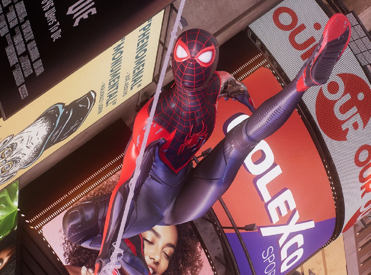 There is an image of Miles Morales swinging through New York City. He is kicking his leg up while holding onto his webbing to swing. 