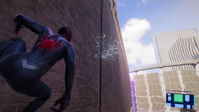 Spider-Man clinging to a wall, looking at a broken cable