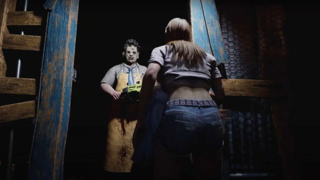 Leatherface standing in front of Connie in a doorway