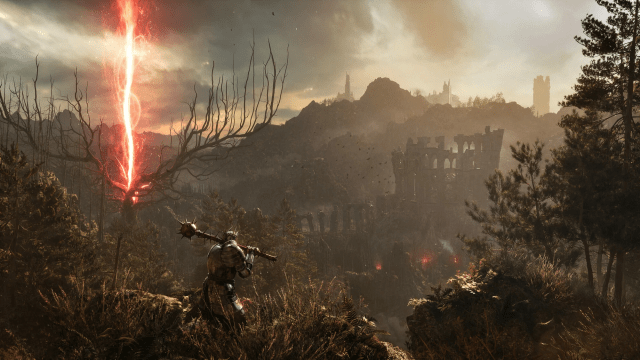 Lords of the Fallen character looks into the view of ruins surronded by forest and a red lighting striking a big tree.
