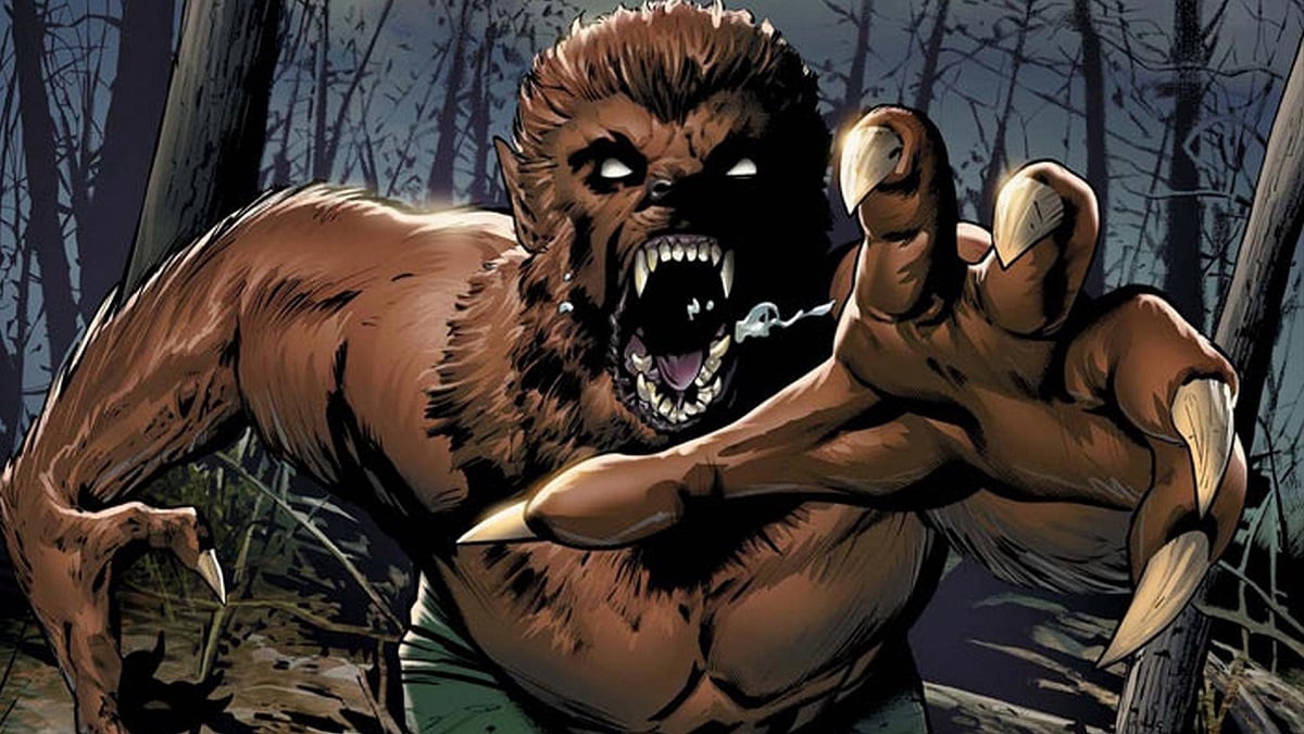 Werewolf by Night in the comics, running and showing his fangs, claws, and brown fur skin.