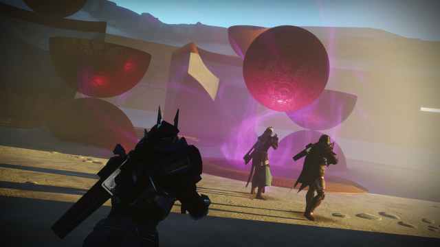 Three Guardians approach a floating sphere wrapped in a purple glow.