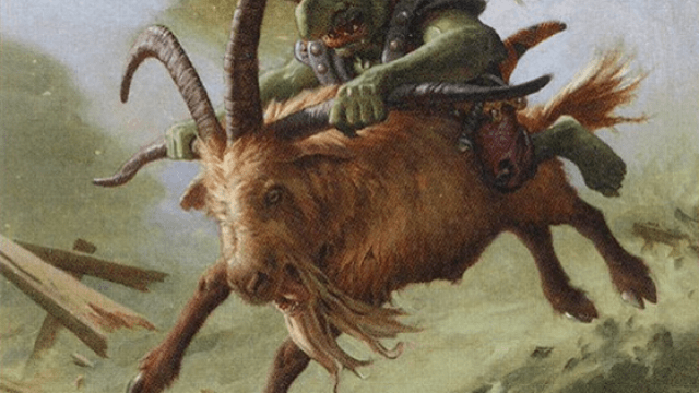 A golden-furred goat runs wild while a small, green-skinned goblin with a knife has climbed on top of it in MtG.