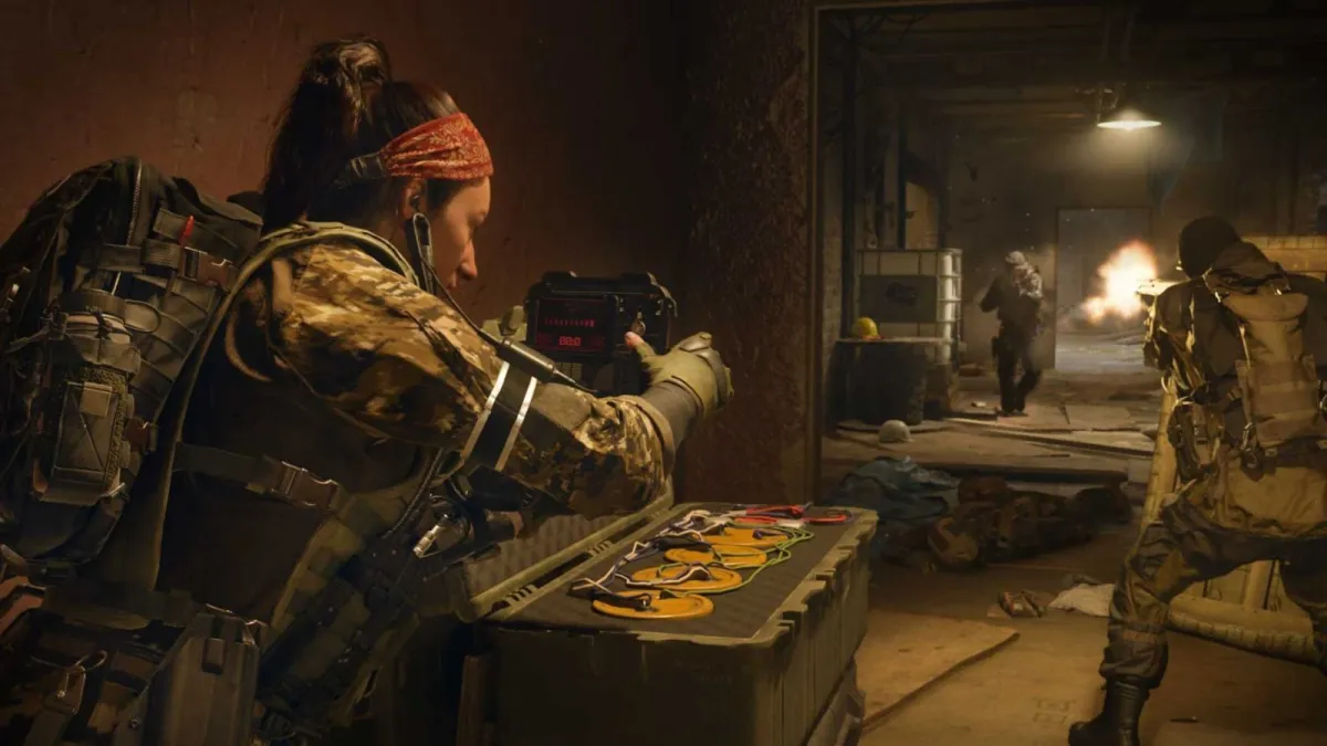 A soldier aims their weapon down a hallway in Modern Warfare 3.