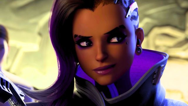 Sombra smirking as she interrogates a woman in Overwatch 2