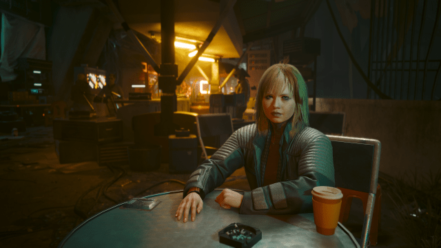 Nele, the character who gives the gig Road to Redemption, sitting across from V in Dogtown Stadium (Cyberpunk 2077).