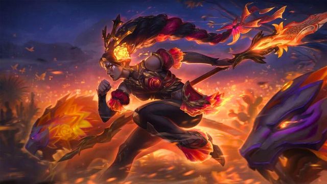 Nidalee wielding a fiery spear with hounds by her side in League of Legends