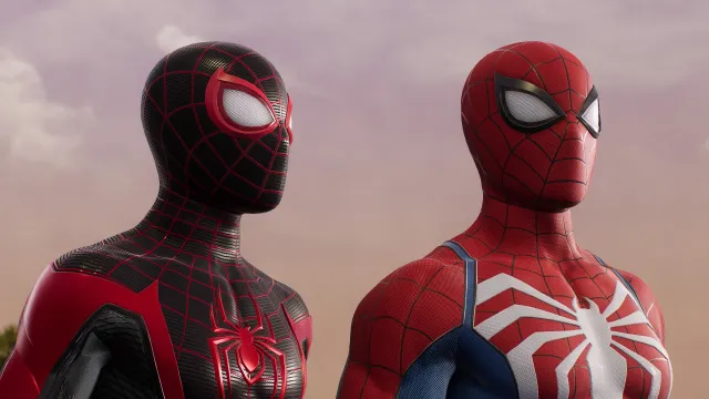 A screenshot of Miles Morales and Peter Parker, Spider-Men, looking at something in the distance.