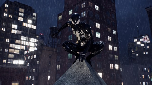 Peter Parker perched on a rooftop while wearing the black symbiote suit.