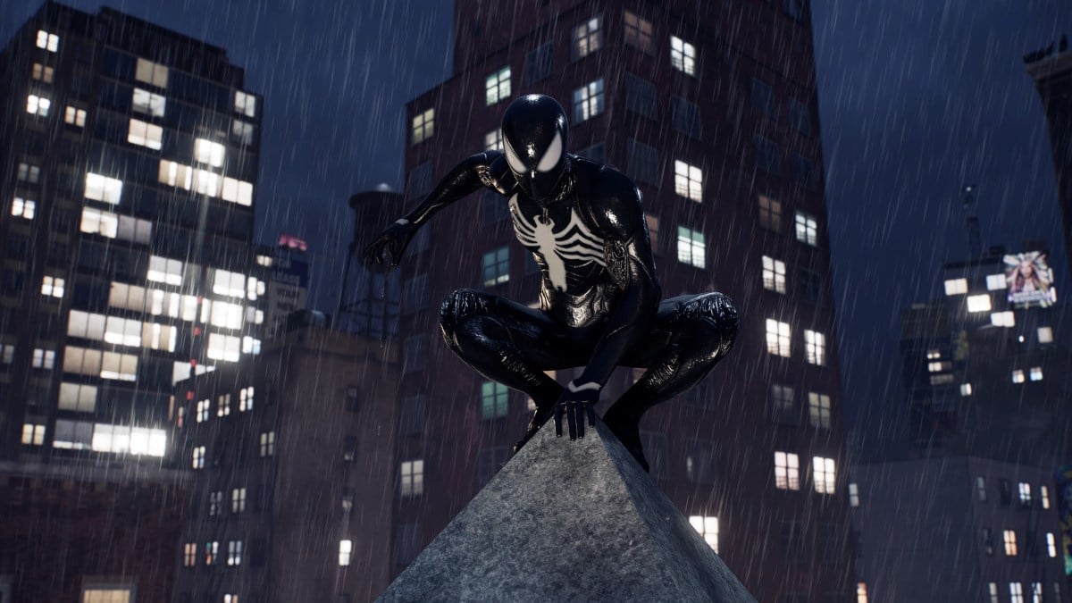 A screenshot of Peter Parker in the symbiote suit, perched on a NYC rooftop in Spider-Man 2.