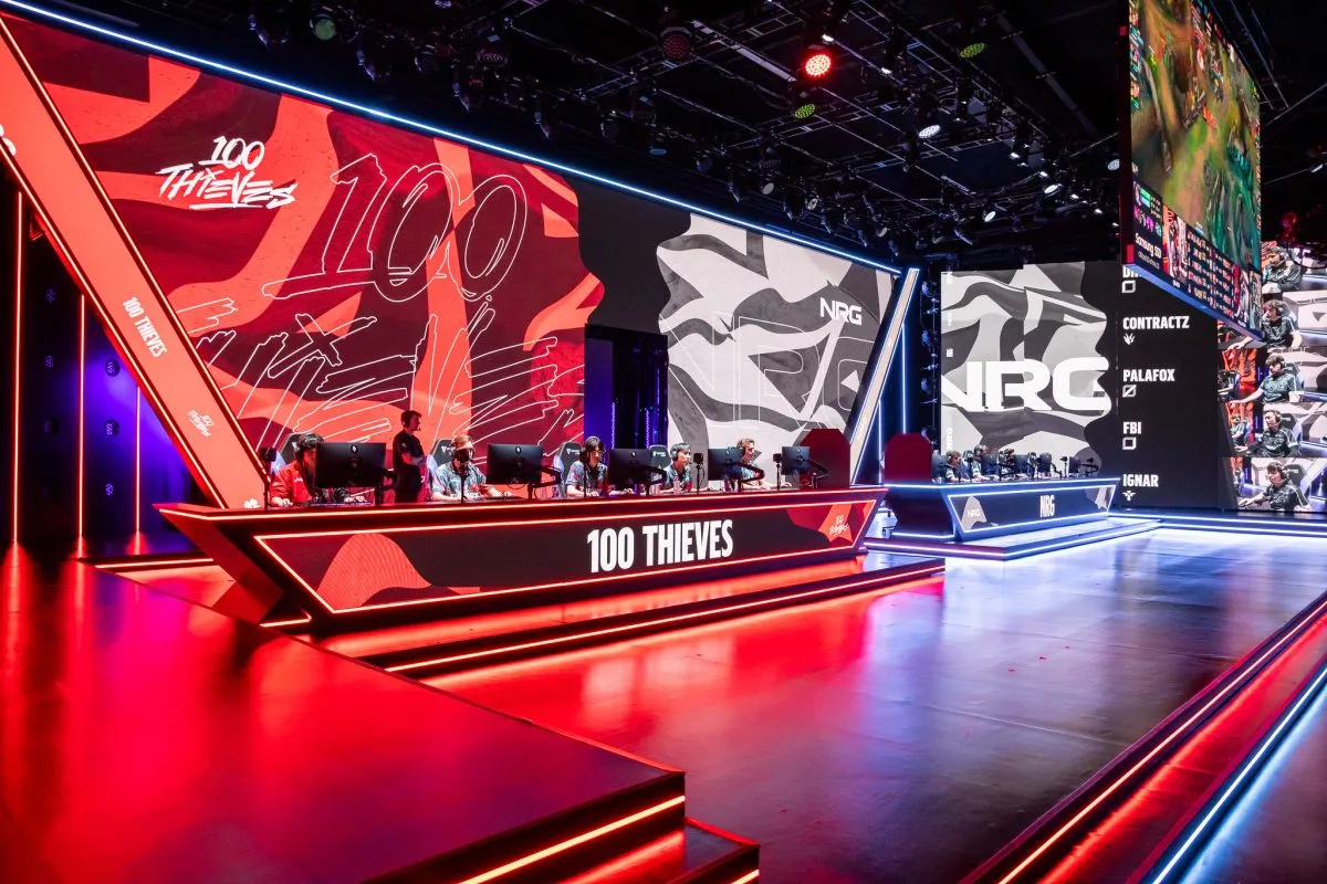 The LCS stage lit up in red for a 100 Thieves match against NRG Esports in 2023 Summer Split