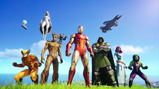 Marvel characters standing in a row in a grassy field with the Fortnite's Battle Bus and the Avengers Helicarrier in the background