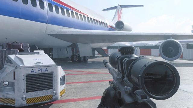 Image showcasing a map from MW3 with a sniper rifle on screen. There is a blue, red, and white plane visible with cargo movers present at the side of the player. Red lines lay along the tarmac.