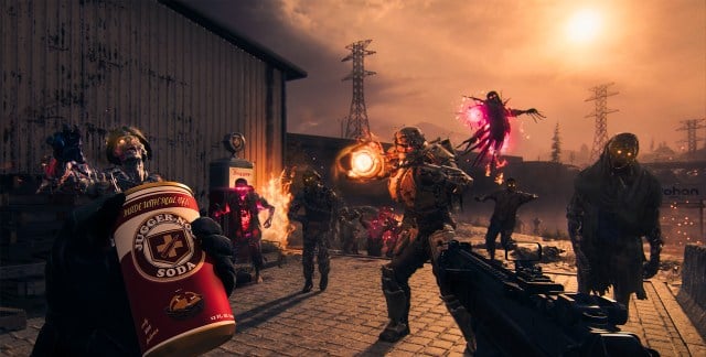 A player holds a Jugger-Nog Perk Can in their hands while a swam of Zombies approach.