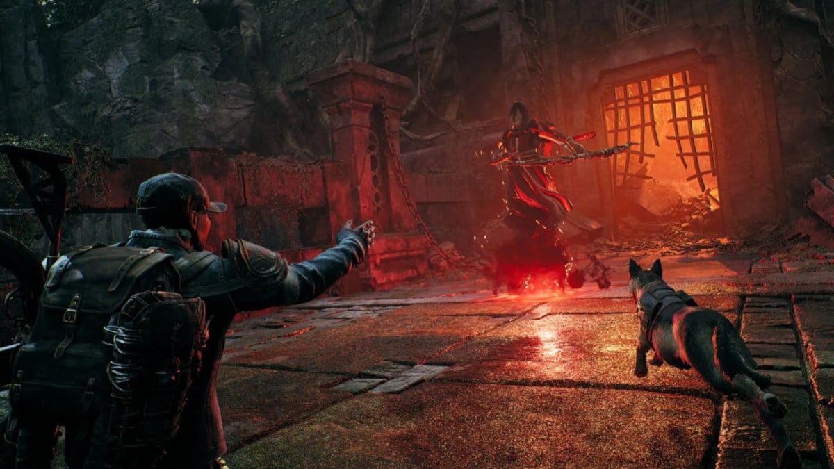 A character and their dog attacking a boss in Remnant 2.