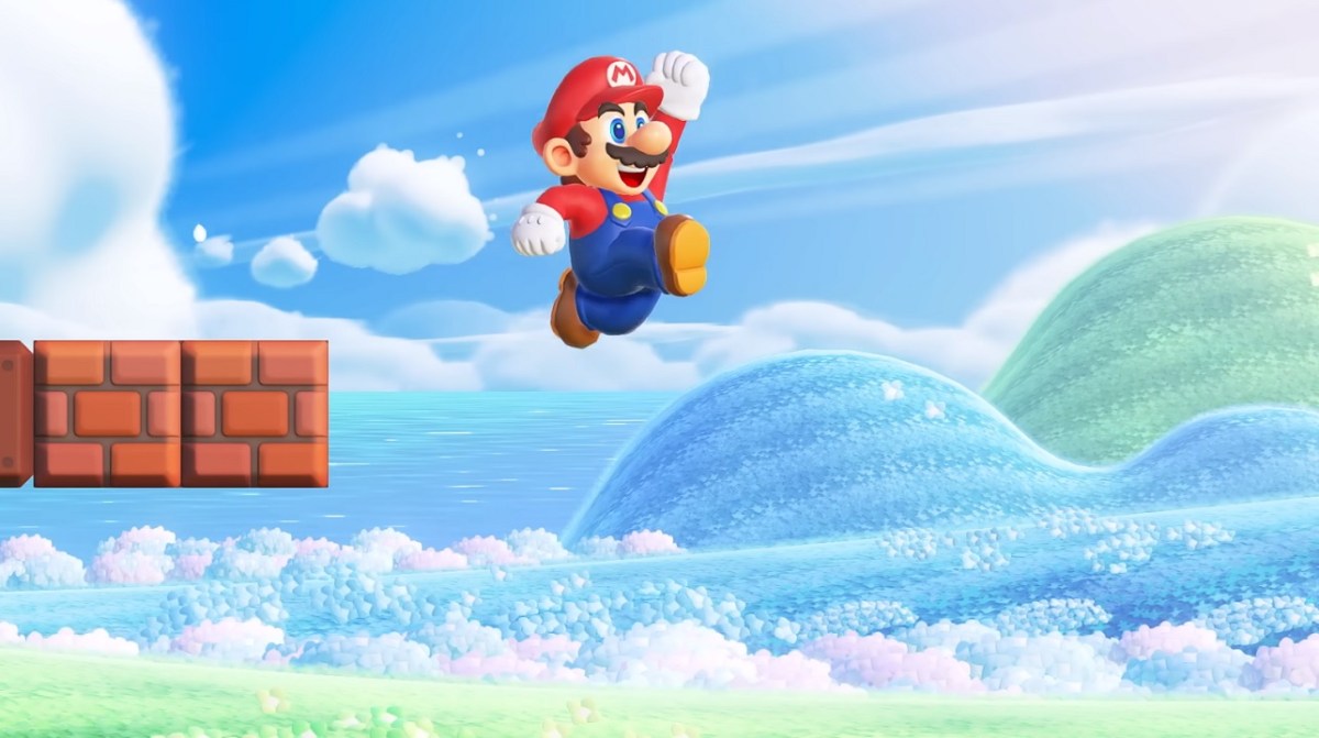 There is a shot of Mario jumping. There is a blue sky behind him and some blocks floating near him.
